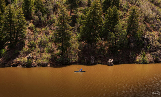 Kayaker Paddling on Causey Resrvoir in Utah.