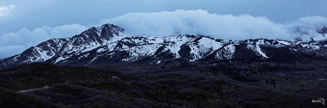 Snowbasin Resort with clouds and mountain.