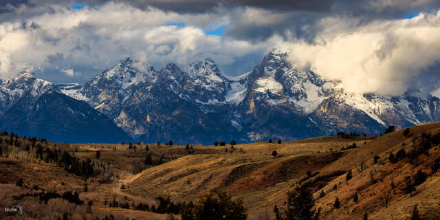 Storm clouds over the Cathedral Group of the Teton Mountains. 