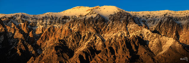 Mountains of Ogden, Utah lit up with an alpenglow.