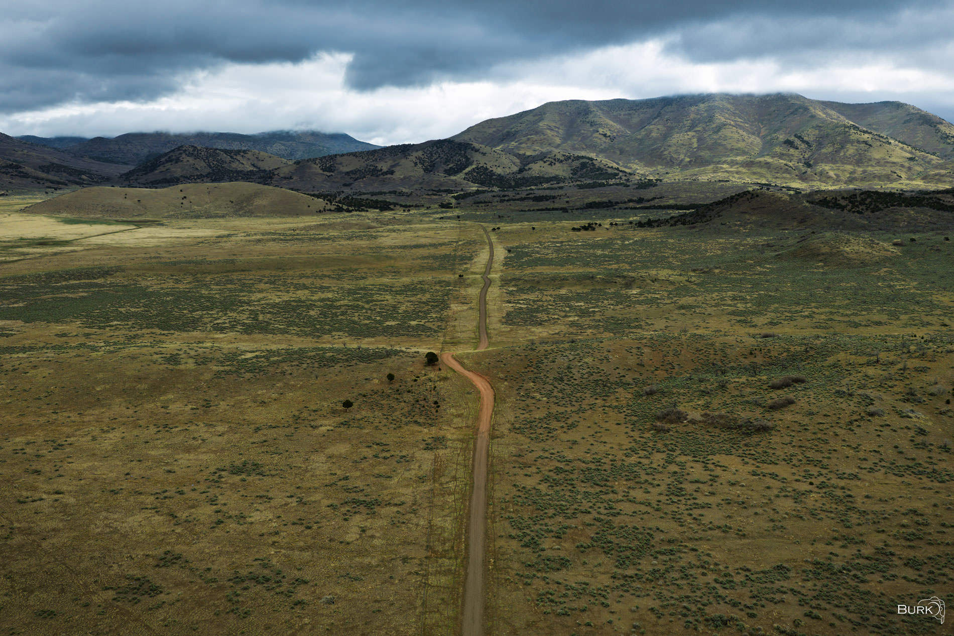 Long Road Home Dirt road leading to mountains