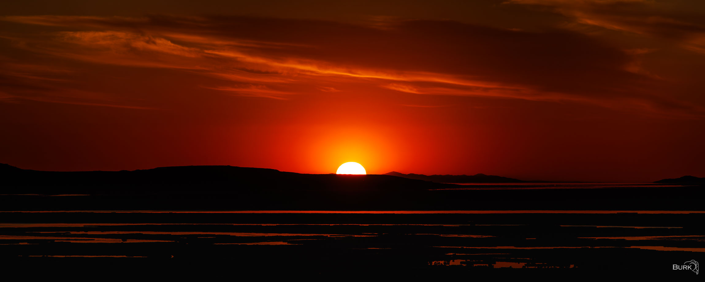 The Closing Flame A quiet evening glow settles across the Great Salt Lake as day gives way to night.