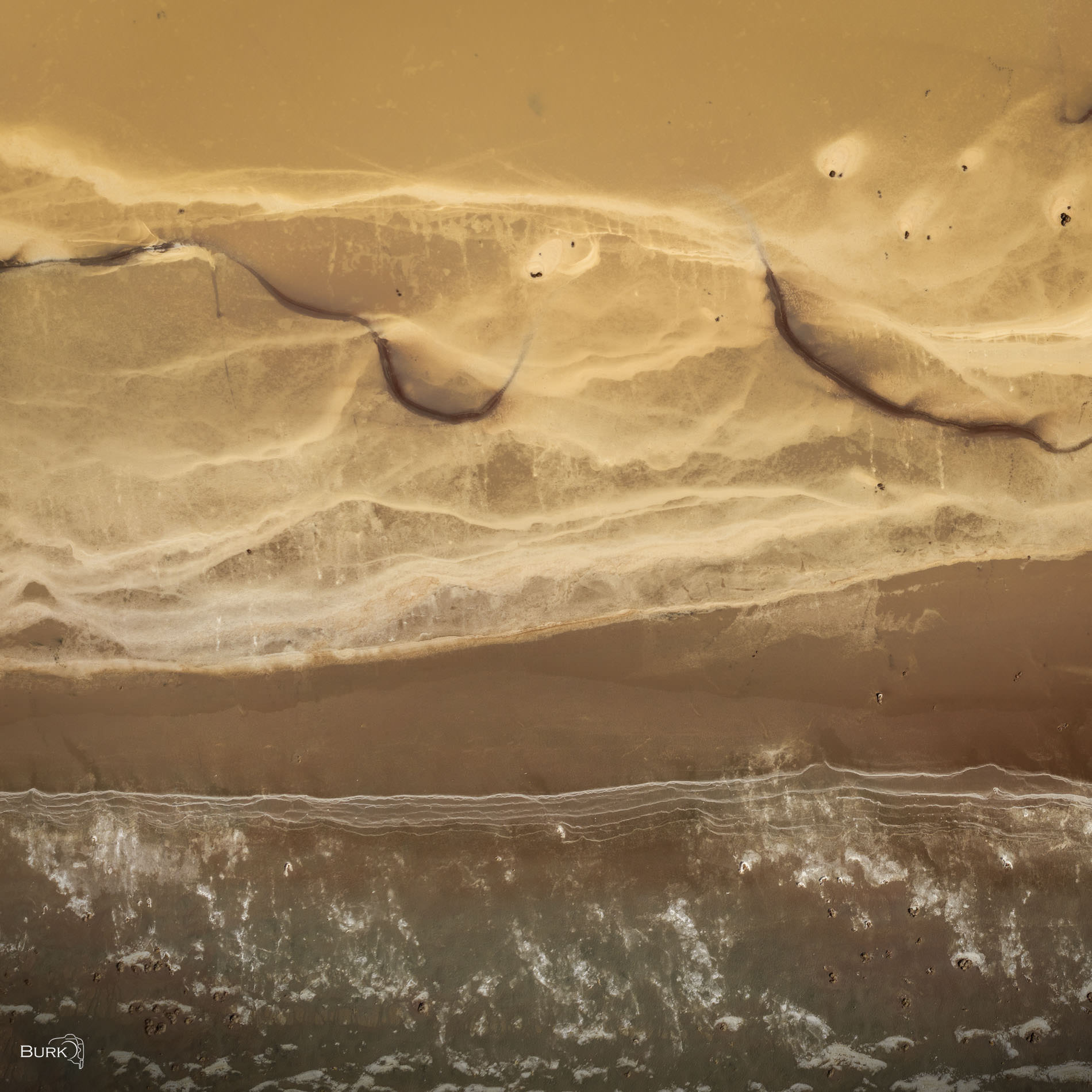 Lakebed Patterns From above, layers of sediment, mineral deposits, and receding water create intricate patterns across the lakebed. Soft earth...
