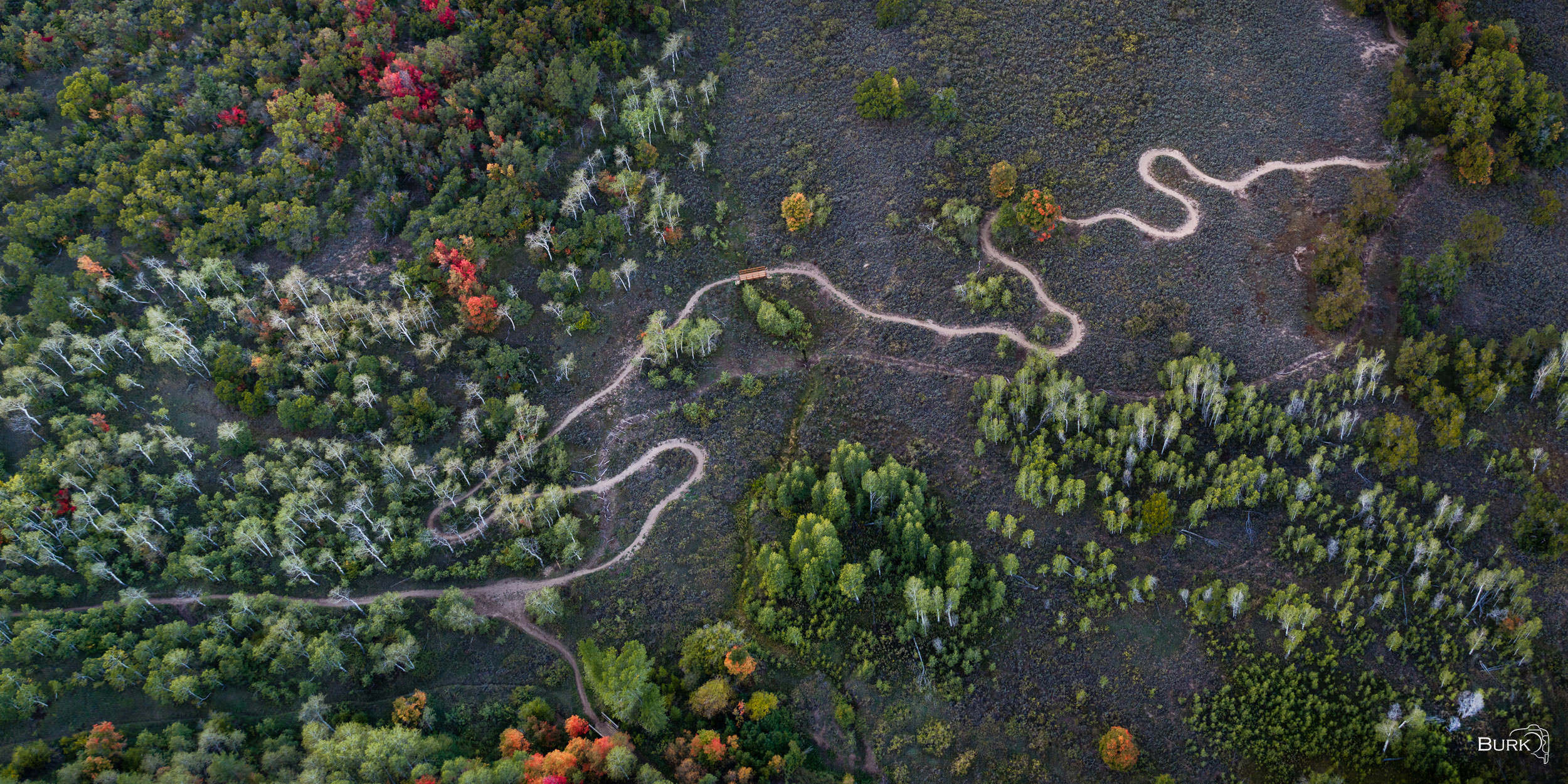 Sardine Peak Trailhead An aerial view of the Sardine Peak Trail as it winds through the autumn landscape near Snowbasin, Utah.