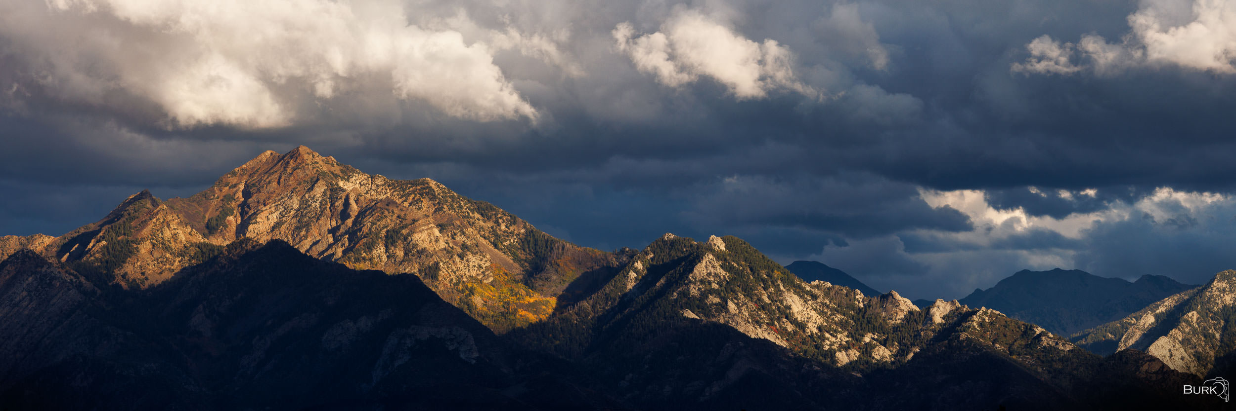 Breaking Light Photographed from the west side of the Salt Lake Valley, this autumn view looks east toward the Wasatch Mountains, including...